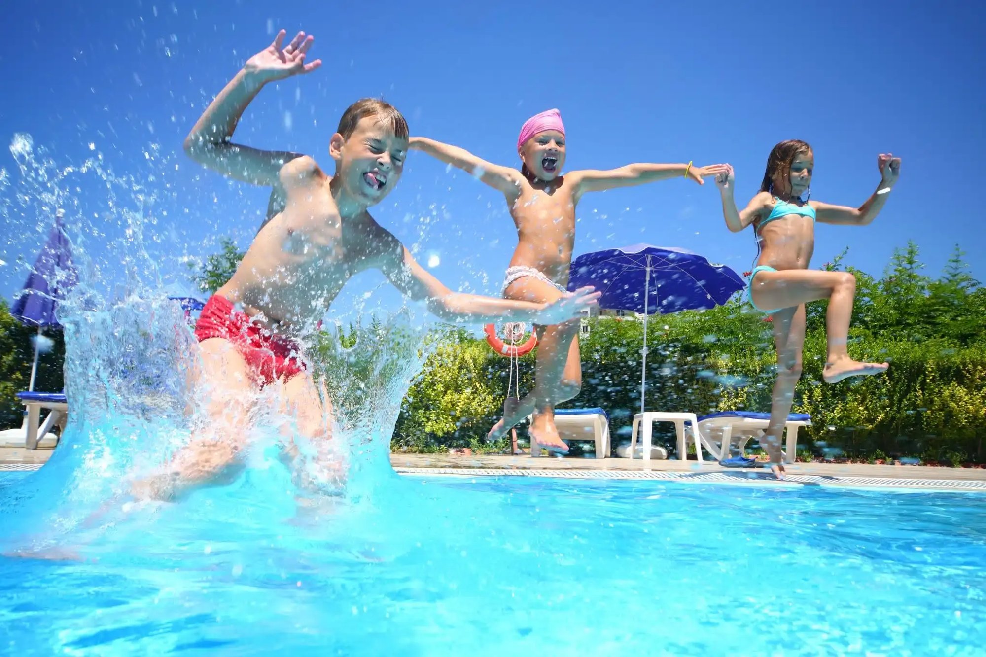 Kids-have-a-ball-jumping-into-an-inground-swimming-pool-2048x1365.jpeg